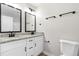 Bathroom featuring double granite vanity and modern fixtures at 1211 N Guthrie Ave, Durham, NC 27703