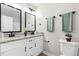 Stylish bathroom featuring double vanities with granite countertops and modern fixtures at 1211 N Guthrie Ave, Durham, NC 27703