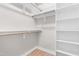 Spacious walk-in closet with wood shelving and ample storage space at 1211 N Guthrie Ave, Durham, NC 27703