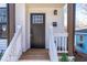 Charming entryway with a black front door, white trim, and an address plaque reading 1211B at 1211 N Guthrie Ave, Durham, NC 27703