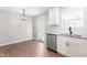 Bright kitchen area featuring granite countertops, stainless steel appliances, and an adjacent door to the backyard at 1211 N Guthrie Ave, Durham, NC 27703
