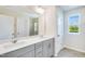 Bathroom with a double sink vanity, a walk-in shower, and a window at 1236 Maple Branch Cir, Graham, NC 27253