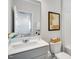 A clean bathroom featuring a modern vanity and a shower-tub combination for convenience and style at 1236 Maple Branch Cir, Graham, NC 27253