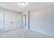 Standard bedroom with a double door closet and neutral carpet flooring at 1236 Maple Branch Cir, Graham, NC 27253