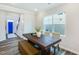 Dining room area featuring hardwood floors and a modern rustic dining set at 1236 Maple Branch Cir, Graham, NC 27253