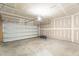A spacious garage ready for customization with a clean concrete floor and ample overhead space at 1236 Maple Branch Cir, Graham, NC 27253
