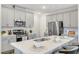 Charming kitchen features stainless appliances, white cabinetry, and a large island at 1236 Maple Branch Cir, Graham, NC 27253