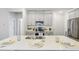 Beautiful kitchen with a central island, stainless steel appliances, and gray cabinets at 1236 Maple Branch Cir, Graham, NC 27253