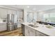 Kitchen featuring stainless steel appliances, white countertops and hardwood floors at 1236 Maple Branch Cir, Graham, NC 27253
