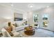 Comfortable living room with large windows, stylish decor, and plush seating at 1236 Maple Branch Cir, Graham, NC 27253