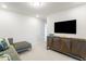 A stylish living room is equipped with a flat-screen TV and modern furnishings at 1236 Maple Branch Cir, Graham, NC 27253