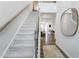 Bright entryway with hardwood floors and a staircase leading to the second floor at 1236 Maple Branch Cir, Graham, NC 27253