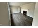 Bright living room featuring a fireplace, large windows, and modern flooring at 1315 Pearleman Teague Rd, Siler City, NC 27344