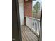 Outdoor balcony with wood floors and white railings at 1647 Kenmore Dr, Clayton, NC 27520