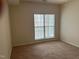 Cozy bedroom with neutral carpet and a window providing natural light at 1647 Kenmore Dr, Clayton, NC 27520