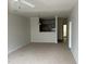 Open-concept living room with neutral carpet and a view to the kitchen at 1647 Kenmore Dr, Clayton, NC 27520
