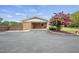 Brick carport with an asphalt driveway and a privacy fence at 1687 Galilee Rd, Smithfield, NC 27577