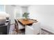 Dining area featuring a wood table, stylish chairs, and modern decor at 1748 Post Oak Dr, Haw River, NC 27258