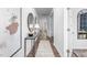 Bright hallway with hardwood floors, stylish console table, and elegant decor at 1748 Post Oak Dr, Haw River, NC 27258