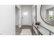 Hallway features wood floors, elegant decorations, and natural light at 1748 Post Oak Dr, Haw River, NC 27258