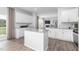 Open concept kitchen with granite countertops, stainless steel appliances, hardwood floors, and island at 1748 Post Oak Dr, Haw River, NC 27258