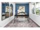 Home office with stylish decor, ample natural light, and a comfortable workspace at 1748 Post Oak Dr, Haw River, NC 27258