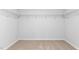 Spacious walk-in closet with ample storage and neutral carpet at 1748 Post Oak Dr, Haw River, NC 27258