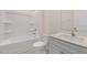 Clean, well-lit bathroom with a shower-tub combination, a white toilet, and modern vanity at 1749 Post Oak Dr, Haw River, NC 27258