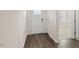A welcoming entryway features wood-look flooring and a view into a carpeted living space at 1749 Post Oak Dr, Haw River, NC 27258