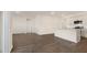 Open-concept living space with a modern kitchen featuring an island, stainless steel appliances, and sleek countertops at 1749 Post Oak Dr, Haw River, NC 27258