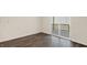 Cozy living area featuring wood flooring and a sliding door that opens to a deck, perfect for outdoor enjoyment at 1749 Post Oak Dr, Haw River, NC 27258