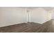 Spacious living room featuring beautiful wood flooring and neutral paint, offering a clean and modern aesthetic at 1749 Post Oak Dr, Haw River, NC 27258