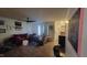 Cozy living room with laminate floors, a ceiling fan, and natural light at 1811 Meadow Green Dr, Graham, NC 27253