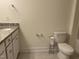 Small bathroom with granite vanity, toilet, and towel racks at 185 Bourne Dr, Franklinton, NC 27525