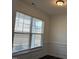 The dining room has wainscoting and a window at 185 Bourne Dr, Franklinton, NC 27525