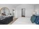 Bedroom with a view of the hall, round mirror, comfortable bed and stylish decor at 1914 Frost Dr, Haw River, NC 27258