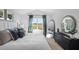 Bedroom with a large window overlooking a green field, plus a comfortable bed and stylish decor at 1914 Frost Dr, Haw River, NC 27258