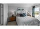 Bright bedroom with a large window, comfortable bed, and stylish decor at 1914 Frost Dr, Haw River, NC 27258