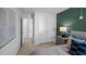 Bedroom with a walk-in closet and a green accent wall at 1914 Frost Dr, Haw River, NC 27258