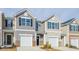 Charming townhouse featuring an attached one car garage and neutral siding at 1914 Frost Dr, Haw River, NC 27258