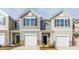 Charming townhouse featuring an attached one car garage and neutral siding at 1914 Frost Dr, Haw River, NC 27258