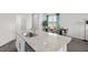 Modern kitchen featuring granite countertops, stainless appliances, and a dining area at 1914 Frost Dr, Haw River, NC 27258