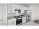 Modern kitchen with white cabinets, stainless steel appliances and granite countertops at 1914 Frost Dr, Haw River, NC 27258