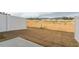 Backyard with a fresh layer of sod and a sturdy white fence for added privacy and security at 1916 Frost Dr, Haw River, NC 27258
