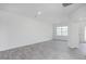 Open concept room with neutral paint and laminate flooring at 1916 Frost Dr, Haw River, NC 27258