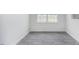 Small room with laminate flooring and window with outside view at 1916 Frost Dr, Haw River, NC 27258