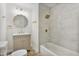 Renovated bathroom featuring updated vanity, lighting, and a shower-tub combination at 1924 Carr Crk, Sanford, NC 27332