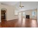 Cozy living room featuring a fireplace, hardwood floors, and an open floor plan at 2030 Fawn Meadow Way, Fuquay Varina, NC 27526