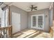 Covered back porch with wooden flooring and a ceiling fan at 2623 Broad Oaks Pl, Raleigh, NC 27603