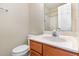 Bathroom featuring a white toilet, shower and a light oak vanity at 2623 Broad Oaks Pl, Raleigh, NC 27603
